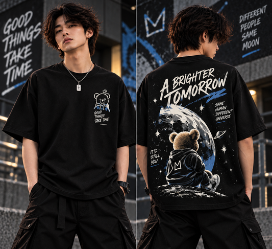 Front and back view of black oversized teddy bear graphic t-shirt with space artwork