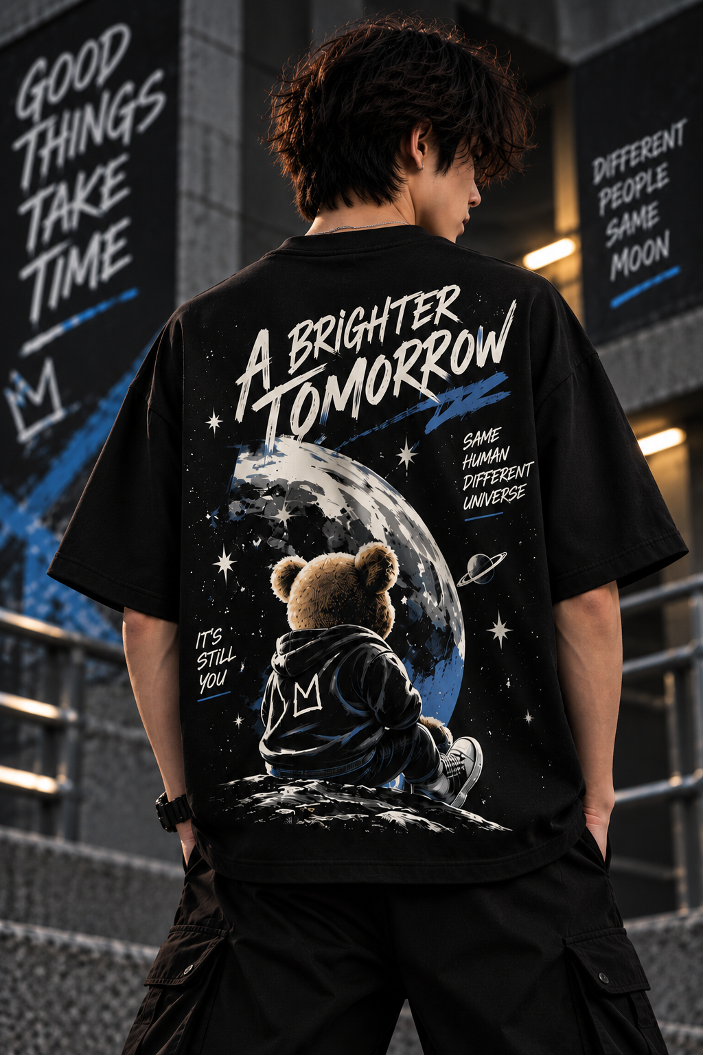 Model wearing black oversized t-shirt featuring teddy bear, moon and A Brighter Tomorrow back graphic