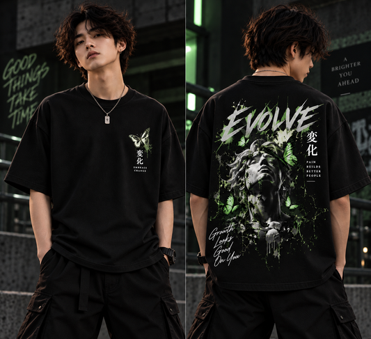 Front and back view of black oversized Evolve t-shirt with green butterfly artwork